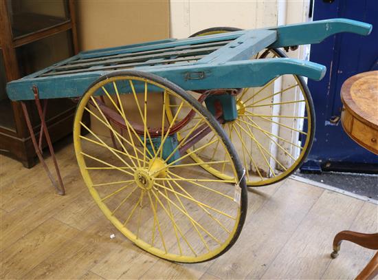 A Victorian blue painted wooden market cart, with yellow spoked wheels W.150cm